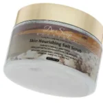 Nourishing salt scrub in elegant container.