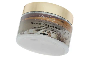 Nourishing salt scrub in elegant container.